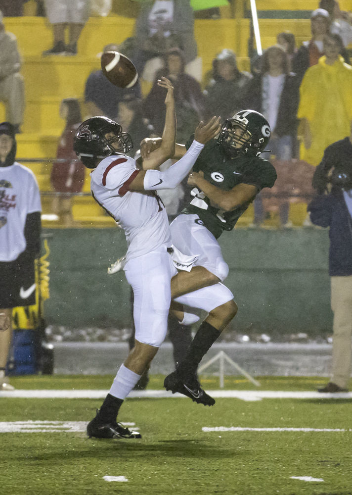 Glenvar's (24) Kyle Hanks breaks up a deep pass that was thrown to Cave Spring's (10) Ethan Coates.